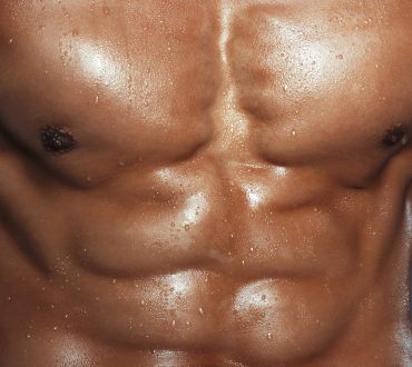 Body of muscular man. Vertical studio shot
